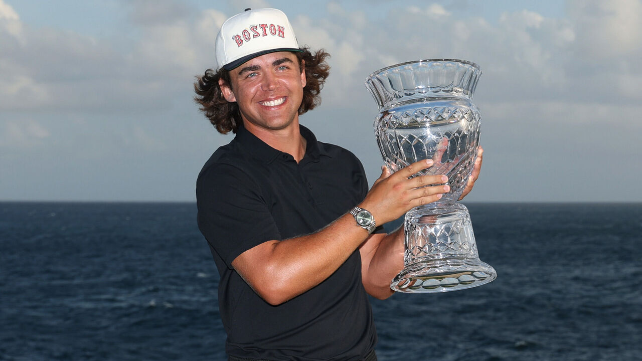 PUNTA CANA, DOMINICAN REPUBLIC - APRIL 20: Garrick Higgo of South Africa poses with the trophy after winning the Corales Puntacana Championship 2025 at Puntacana Resort & Club, Corales Golf Course on April 20, 2025 in Punta Cana, Dominican Republic.