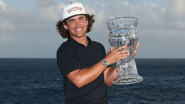 PUNTA CANA, DOMINICAN REPUBLIC - APRIL 20: Garrick Higgo of South Africa poses with the trophy after winning the Corales Puntacana Championship 2025 at Puntacana Resort & Club, Corales Golf Course on April 20, 2025 in Punta Cana, Dominican Republic.