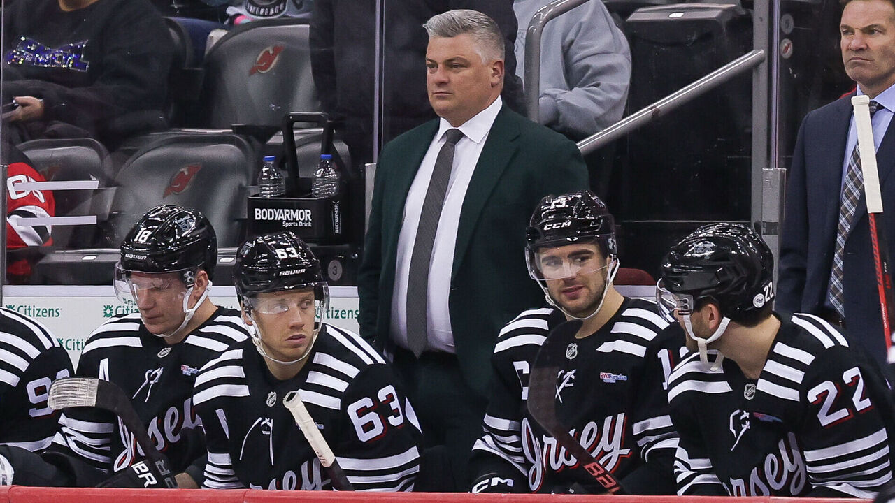 NEWARK, NJ - APRIL 13: New Jersey Devils head coach Sheldon Keefe looks on during a NHL game between the New York Islanders and New Jersey Devils at Prudential Center on April 13, 2025 in Newark, New Jersey.