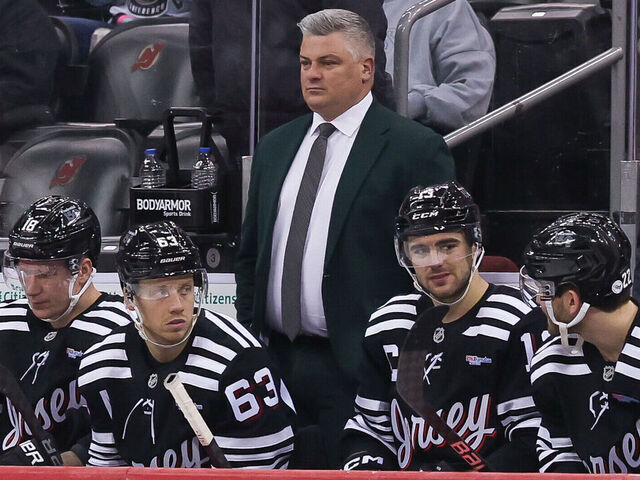 NEWARK, NJ - APRIL 13: New Jersey Devils head coach Sheldon Keefe looks on during a NHL game between the New York Islanders and New Jersey Devils at Prudential Center on April 13, 2025 in Newark, New Jersey.