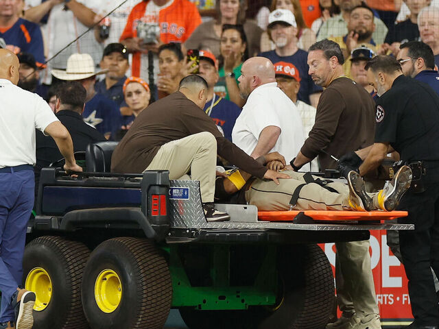 HOUSTON, TEXAS - APRIL 20: Luis Arraez #4 of the San Diego Padres is carted off the field after colliding with Mauricio Dubon in the first inning against the Houston Astros at Daikin Park on April 20, 2025 in Houston, Texas.