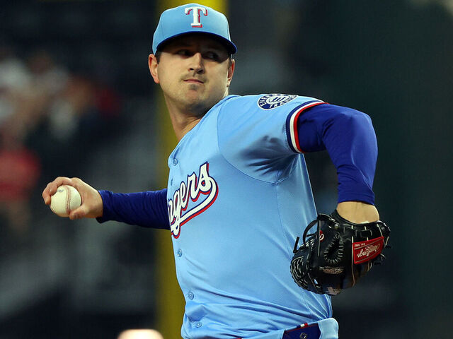 ARLINGTON, TEXAS - APRIL 20: Tyler Mahle #51 of the Texas Rangers pitches in the first inning against the Los Angeles Dodgers at Globe Life Field on April 20, 2025 in Arlington, Texas.