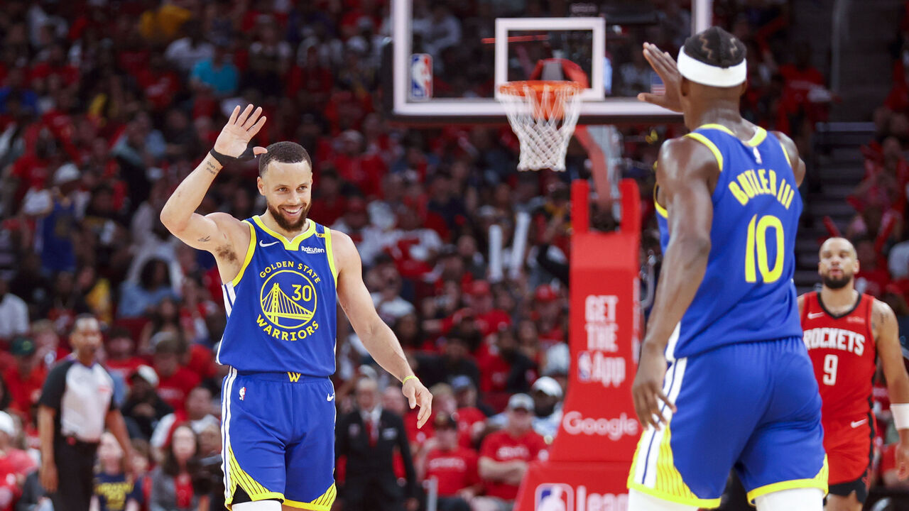 HOUSTON, TX - APRIL 20: Stephen Curry #30 and Jimmy Butler #10 of the Golden State Warriors high five during the game against the Houston Rockets during Round One Game One of the 2025 NBA Playoffs on April 20, 2025 at the Toyota Center in Houston, Texas. Mandatory Copyright Notice: Copyright 2025 NBAE