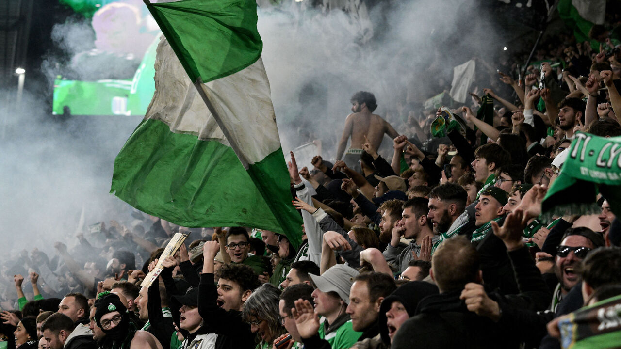 Saint-Etienne's supporters celebrate after winning the French L1 football match between AS Saint-Etienne and Olympique Lyonnais (OL) at the Geoffroy-Guichard Stadium in Saint-Etienne, central France on April 20, 2025.
