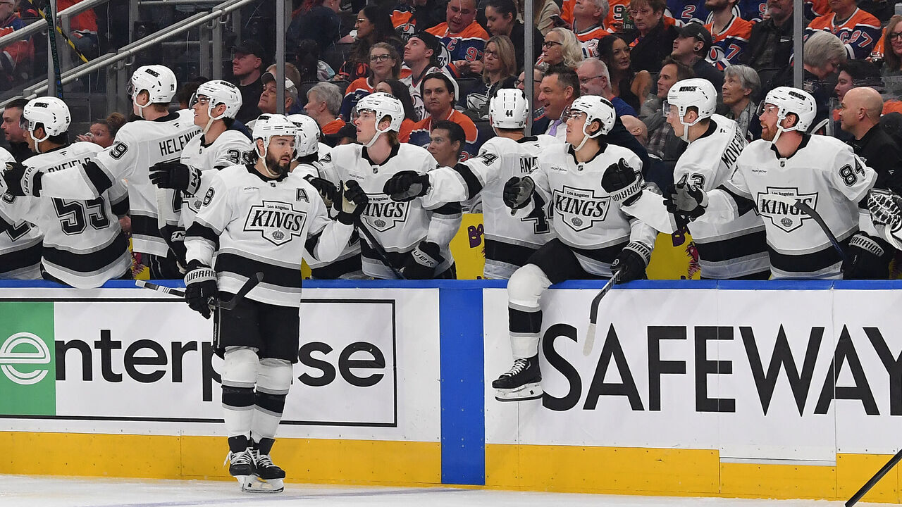 EDMONTON, CANADA - APRIL 14: Drew Doughty #8 of the Los Angeles Kings celebrates a first-period goal by Warren Foegele #37 at the bench during the game against the Edmonton Oilers at Rogers Place on April 14, 2025, in Edmonton, Alberta, Canada.