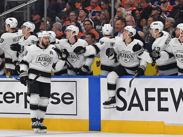 EDMONTON, CANADA - APRIL 14: Drew Doughty #8 of the Los Angeles Kings celebrates a first-period goal by Warren Foegele #37 at the bench during the game against the Edmonton Oilers at Rogers Place on April 14, 2025, in Edmonton, Alberta, Canada.