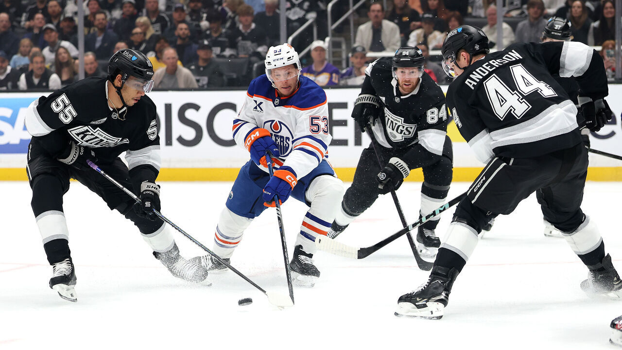 LOS ANGELES, CALIFORNIA - APRIL 21: Jeff Skinner #53 of the Edmonton Oilers attempts to control the puck as Quinton Byfield #55, Vladislav Gavrikov #84, and Mikey Anderson #44 of the Los Angeles Kings defend during the first period in Game One of the First Round of the 2025 Stanley Cup Playoffs at Crypto.com Arena on April 21, 2025 in Los Angeles, California.