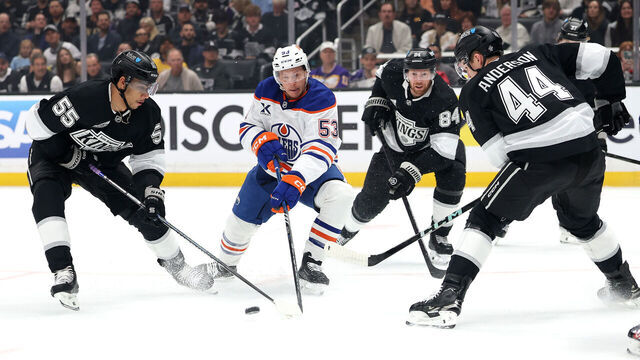 LOS ANGELES, CALIFORNIA - APRIL 21: Jeff Skinner #53 of the Edmonton Oilers attempts to control the puck as Quinton Byfield #55, Vladislav Gavrikov #84, and Mikey Anderson #44 of the Los Angeles Kings defend during the first period in Game One of the First Round of the 2025 Stanley Cup Playoffs at Crypto.com Arena on April 21, 2025 in Los Angeles, California.