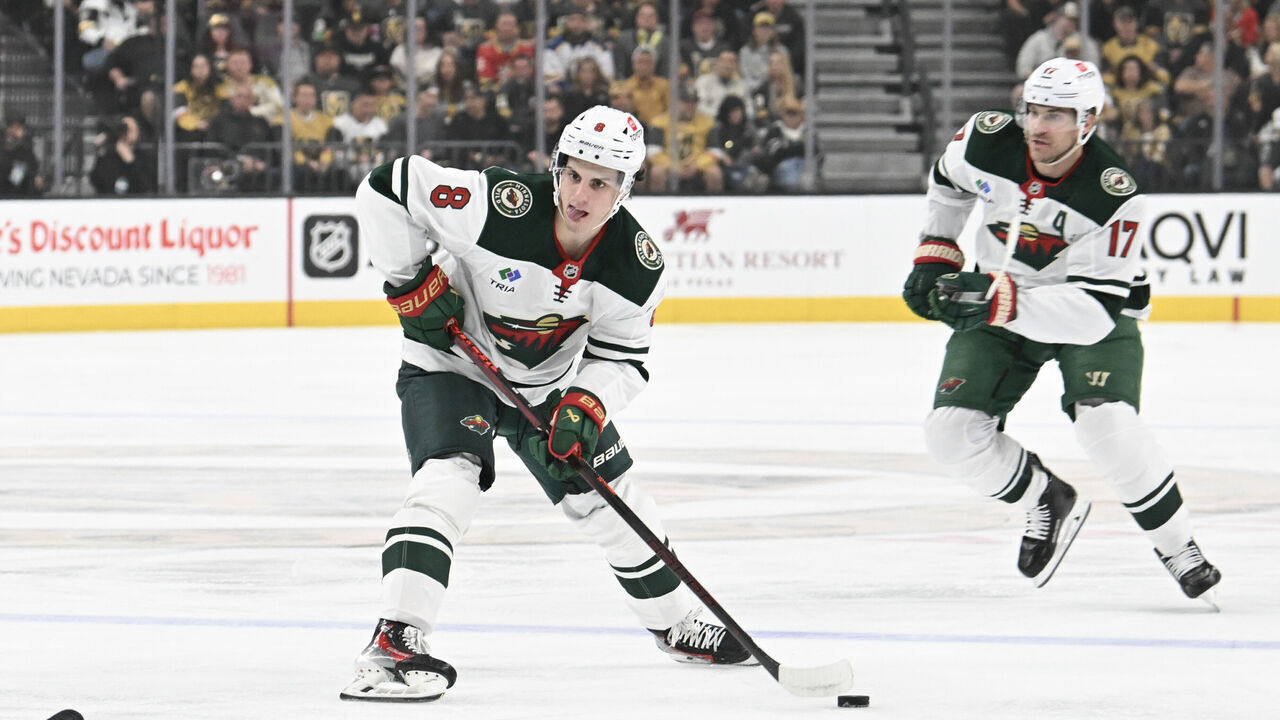 LAS VEGAS, NEVADA - APRIL 20: Zeev Buium #8 of the Minnesota Wild skates with the puck against the Vegas Golden Knights in the first period of Game One of the First Round of the 2025 Stanley Cup Playoffs at T-Mobile Arena on April 20, 2025 in Las Vegas, Nevada. The Golden Knights defeated the Wild 4-2.