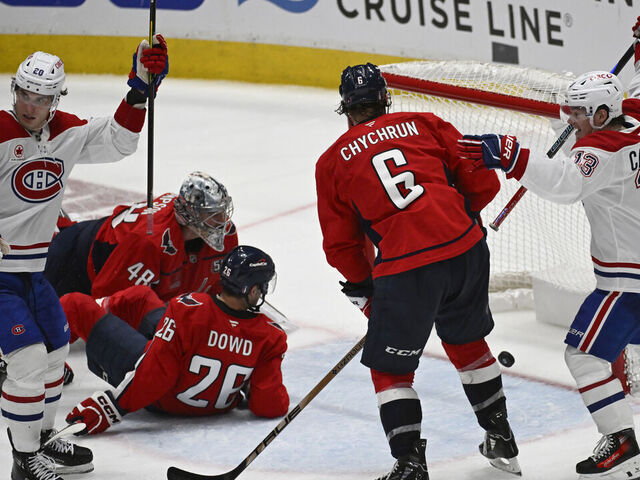 WASHINGTON, DC - APRIL 21: The Montreal Canadiens celebrate the game tying goal past Washington Capitals goaltender Logan Thompson (48) during the third period of game one of a first round playoff hockey game at Capital One Arena in Washington, DC on April 21, 2025.