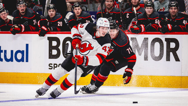 RALEIGH, NORTH CAROLINA - APRIL 20: Luke Hughes #43 of the New Jersey Devils skates with the puck during Game One of the First Round of the 2025 Stanley Cup Playoffs against the Carolina Hurricanes at Lenovo Center on April 20, 2025 in Raleigh, North Carolina.