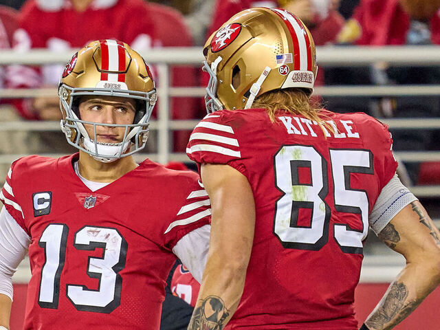 SANTA CLARA, CALIFORNIA - DECEMBER 25: Brock Purdy #13 talks to George Kittle #85 of the San Francisco 49ers in action during a game between the San Francisco 49ers and the Baltimore Ravens at Levi's Stadium on December 25, 2023 in Santa Clara, California.