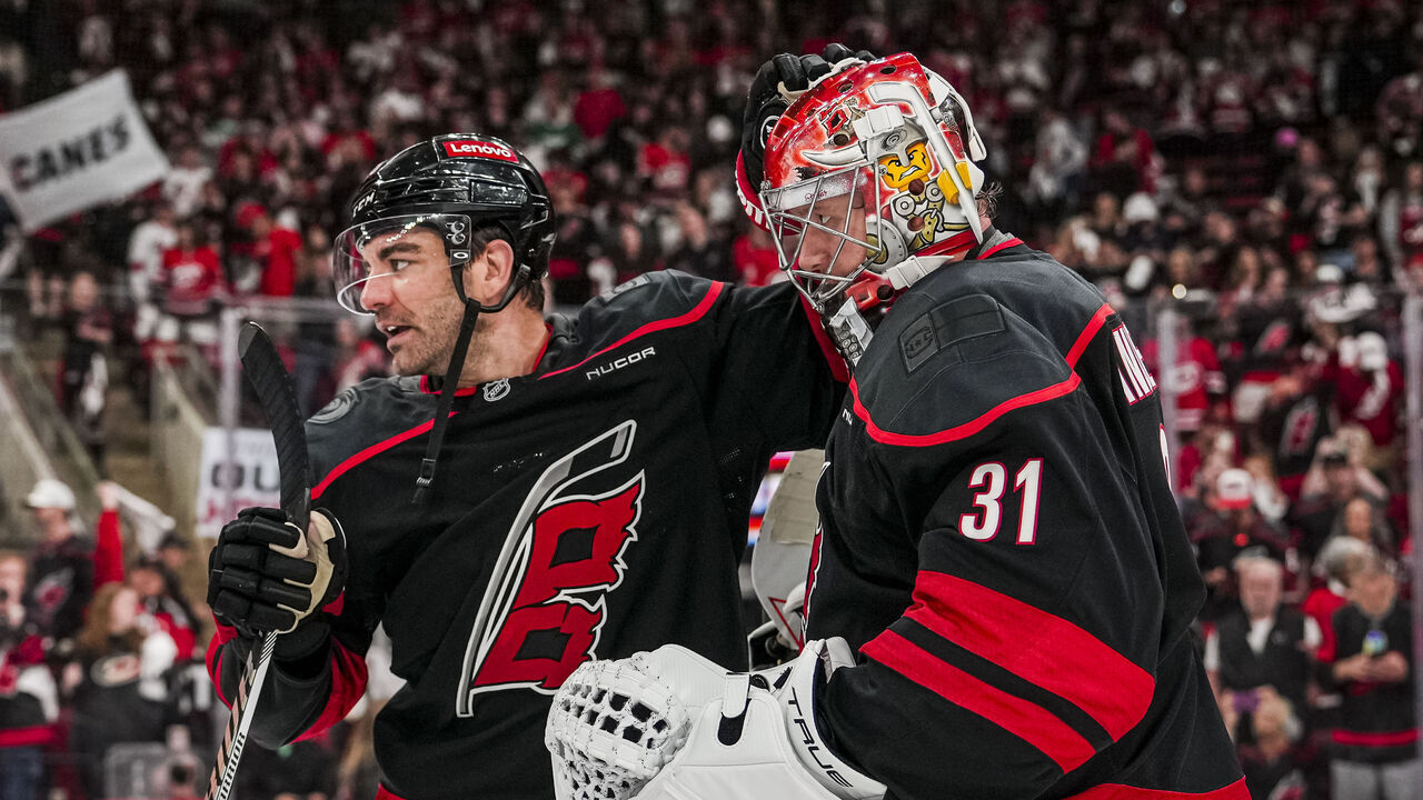 RALEIGH, NORTH CAROLINA - APRIL 20: Frederik Andersen #31 is greeted by Jordan Martinook #48 of the Carolina Hurricanesafter a victory against the New Jersey Devils in Game One of the First Round of the 2025 Stanley Cup Playoffs at Lenovo Center on April 20, 2025 in Raleigh, North Carolina.