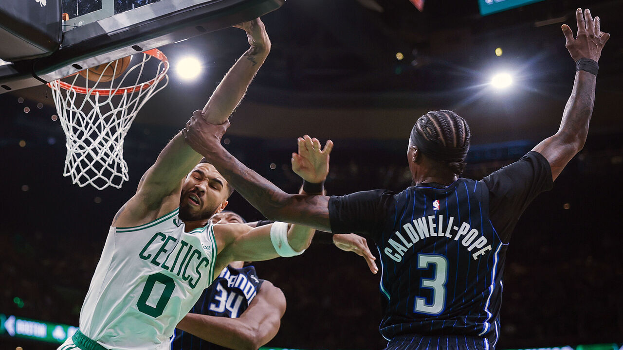 Boston, MA - April 20: Orlando Magic guard Kentavious Caldwell-Pope commits a flagrant foul against Boston Celtics forward Jayson Tatum during Game 1 of the NBA Eastern Conference playoffs against the Orlando Magic at TD Garden.