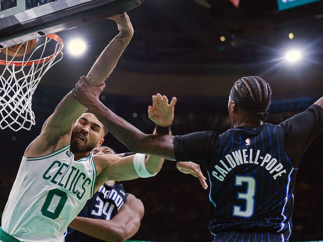 Boston, MA - April 20: Orlando Magic guard Kentavious Caldwell-Pope commits a flagrant foul against Boston Celtics forward Jayson Tatum during Game 1 of the NBA Eastern Conference playoffs against the Orlando Magic at TD Garden.