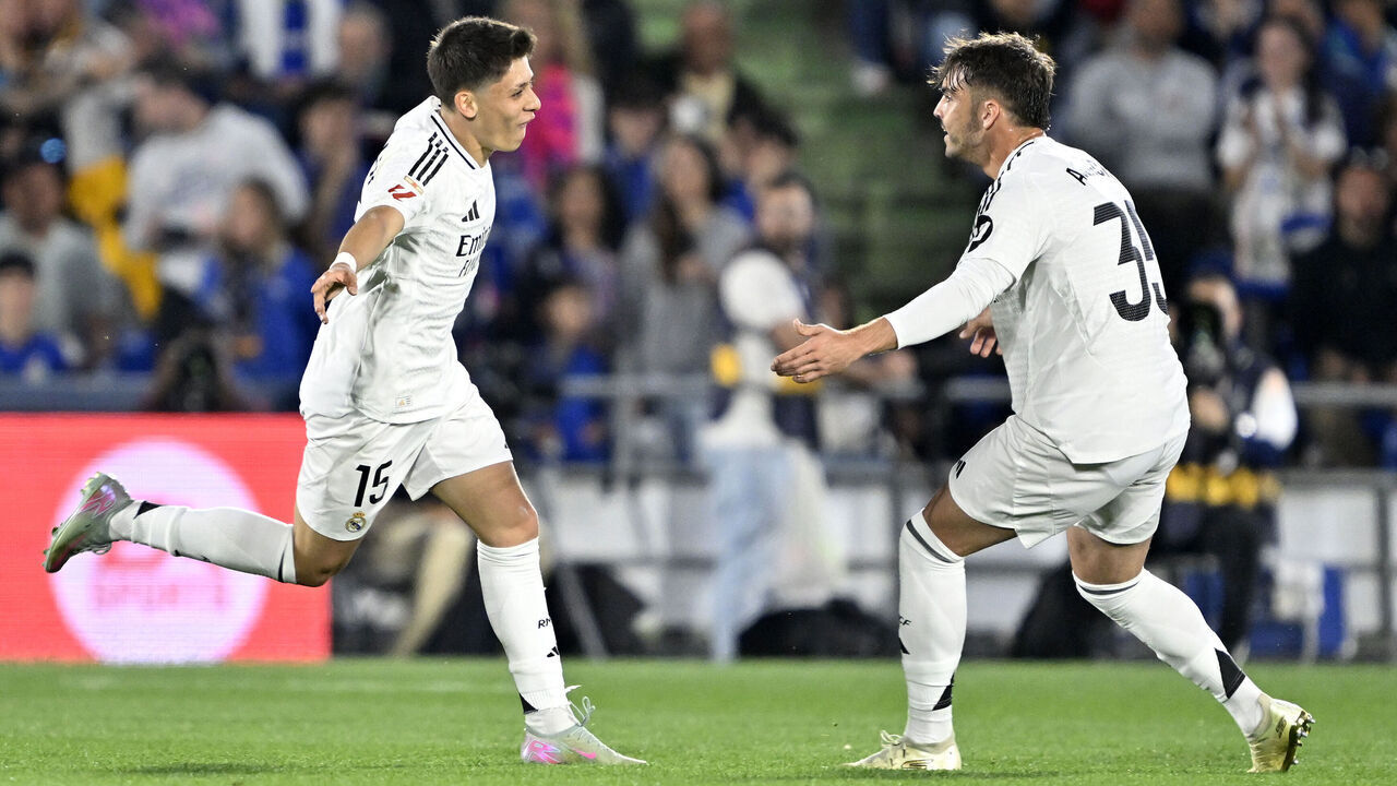 MADRID, SPAIN - APRIL 23: Arda Guler of Real Madrid celebrates with Raul Asencio after scoring a goal during the La Liga week 33 match between Getafe and Real Madrid at Coliseum Alfonso Perez Stadium in Madrid, Spain on April 23, 2025.
