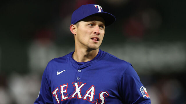CHICAGO, ILLINOIS - APRIL 8: Corey Seager #5 of the Texas Rangers fields a ball during a game against the Chicago Cubs at Wrigley Field on April 8, 2025 in Chicago, Illinois.