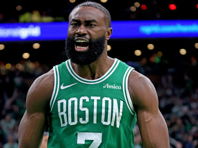Boston, MA - April 23 - Jaylen Brown #7 of the Boston Celtics screams out after dunking against Paolo Banchero #5 of the Orlando Magic uring the third quarter of Game 2 of the Eastern Conference Finals at the TD Garden.
