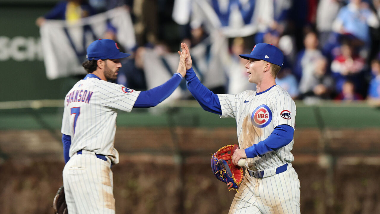 CHICAGO, ILLINOIS - APRIL 23: Dansby Swanson #7 and Pete Crow-Armstrong #4 of the Chicago Cubs celebrate after defeating the Los Angeles Dodgers 7-6 at Wrigley Field on April 23, 2025 in Chicago, Illinois.