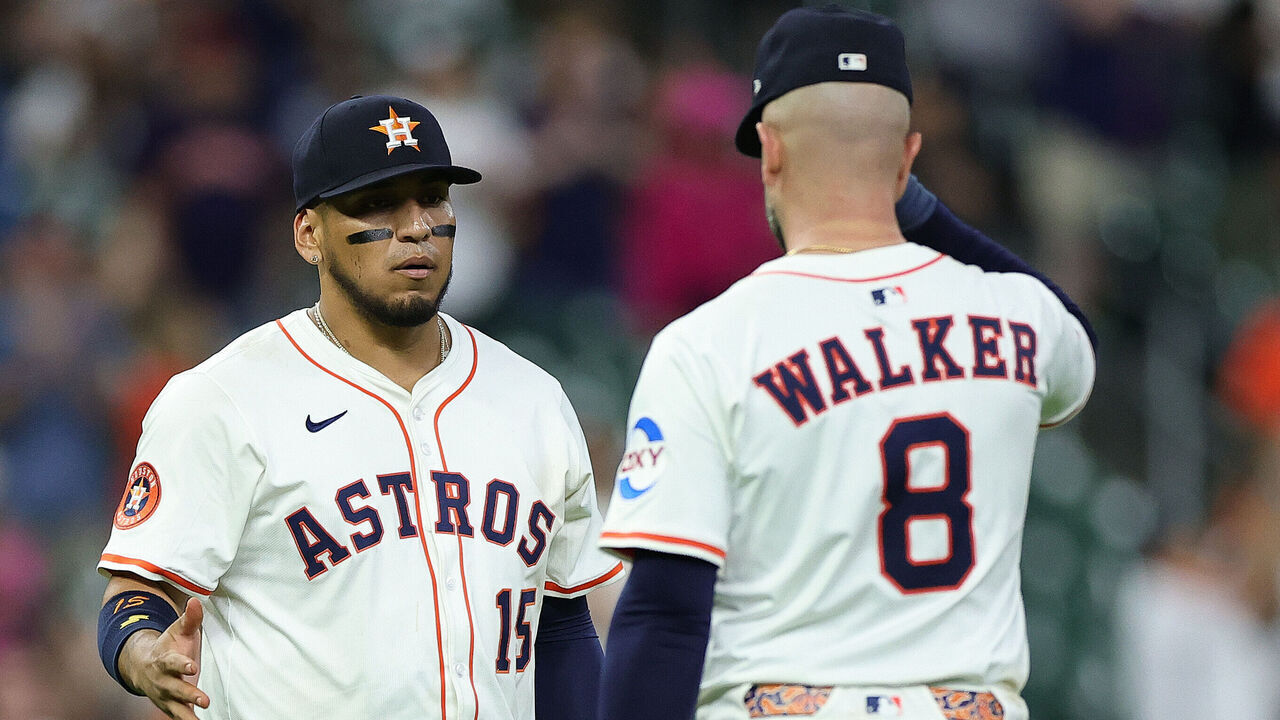 HOUSTON, TEXAS - APRIL 22: Isaac Paredes #15 and Christian Walker #8 of the Houston Astros shake hands after defeating the Toronto Blue Jays at Daikin Park on April 22, 2025 in Houston, Texas.