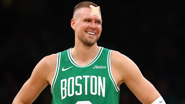 BOSTON, MASSACHUSETTS - APRIL 23: Kristaps Porzingis #8 of the Boston Celtics reacts with a bandage on his head against the Orlando Magic during the third quarter in Game Two of the Eastern Conference First Round NBA Playoffs at TD Garden on April 23, 2025 in Boston, Massachusetts.