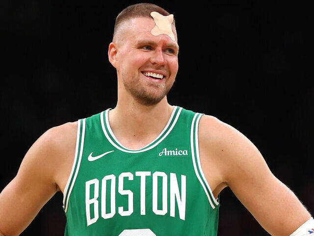 BOSTON, MASSACHUSETTS - APRIL 23: Kristaps Porzingis #8 of the Boston Celtics reacts with a bandage on his head against the Orlando Magic during the third quarter in Game Two of the Eastern Conference First Round NBA Playoffs at TD Garden on April 23, 2025 in Boston, Massachusetts.