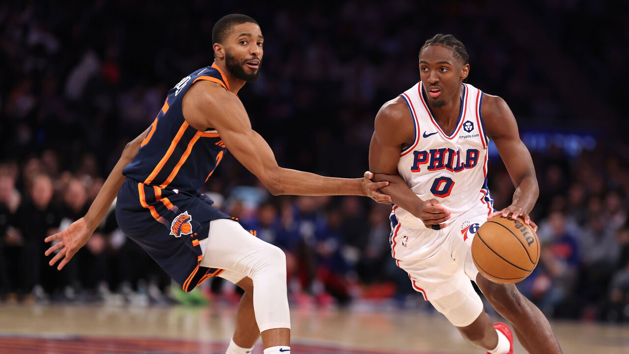NEW YORK, NEW YORK - FEBRUARY 26: Tyrese Maxey #0 of the Philadelphia 76ers drives against Mikal Bridges #25 of the New York Knicks during their game at Madison Square Garden on February 26, 2025 in New York City. User expressly acknowledges and agrees that, by downloading and or using this photograph, User is consenting to the terms and conditions of the Getty Images License Agreement.