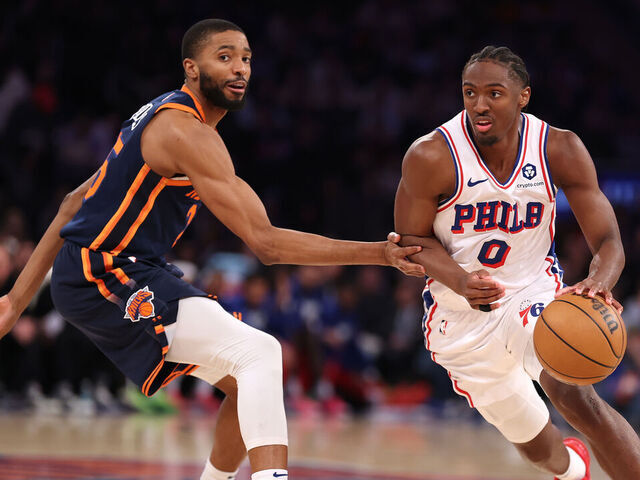 NEW YORK, NEW YORK - FEBRUARY 26: Tyrese Maxey #0 of the Philadelphia 76ers drives against Mikal Bridges #25 of the New York Knicks during their game at Madison Square Garden on February 26, 2025 in New York City. User expressly acknowledges and agrees that, by downloading and or using this photograph, User is consenting to the terms and conditions of the Getty Images License Agreement.