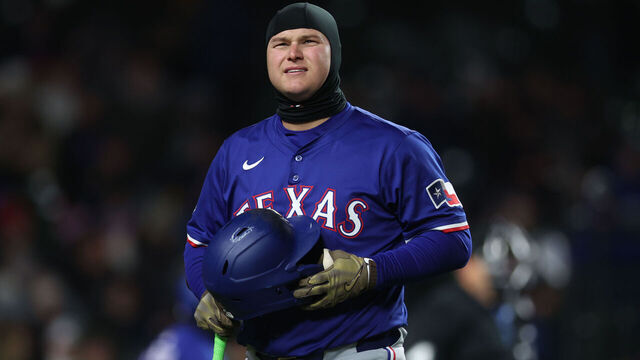 CHICAGO, ILLINOIS - APRIL 8: Joc Pederson #4 of the Texas Rangers looks on during a game against the Chicago Cubs at Wrigley Field on April 8, 2025 in Chicago, Illinois.