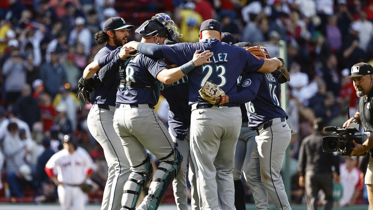 BOSTON, MA - APRIL 24: Seattle Mariners players dance together after their 4-3 win over the Boston Red Sox at Fenway Park on April 24, 2025 in Boston, Massachusetts.
