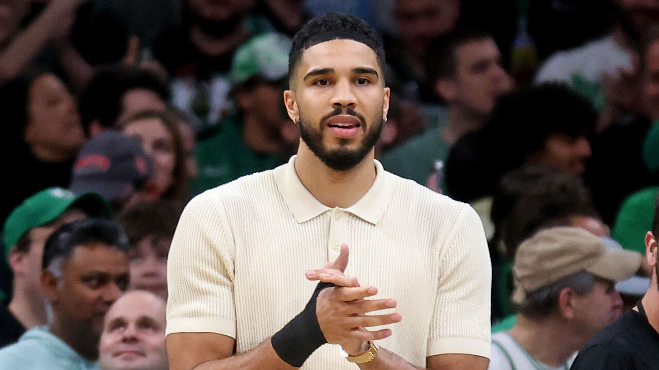 Boston, MA - April 23 - An injured Jayson Tatum #0 of the Boston Celtics applauds on the sidelines during the third quarter of Game 2 of the Eastern Conference Finals at the TD Garden.