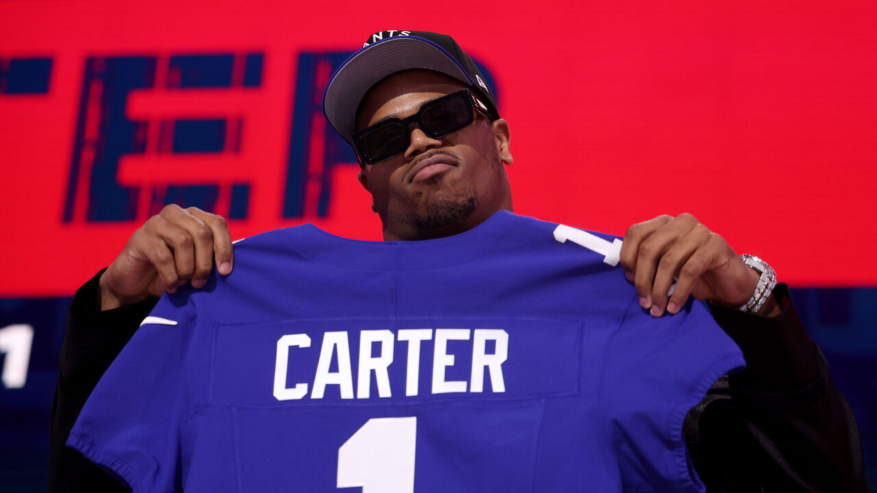 GREEN BAY, WISCONSIN - APRIL 24: Edge Rusher Abdul Carter of Penn State poses after being selected third overall pick by the New York Giants during the first round of the 2025 NFL Draft at Lambeau Field on April 24, 2025 in Green Bay, Wisconsin.