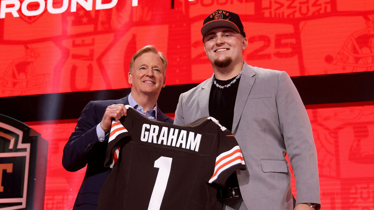 GREEN BAY, WISCONSIN - APRIL 24: Defensive Tackle Mason Graham of Michigan poses with NFL Commissioner Roger Goodell after being selected fifth overall pick by the Cleveland Browns during the first round of the 2025 NFL Draft at Lambeau Field on April 24, 2025 in Green Bay, Wisconsin.