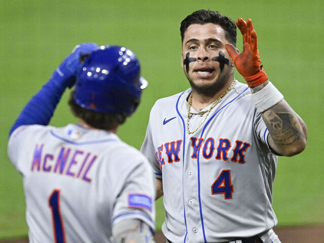 SAN DIEGO, CA - JULY 8: Francisco Alvarez #4 (R) of the New York Mets is congratulated by Jeff McNeil #1 after hitting a solo home run during the sixth inning of a baseball game against the San Diego Padres at Petco Park on July 8, 2023 in San Diego, California.