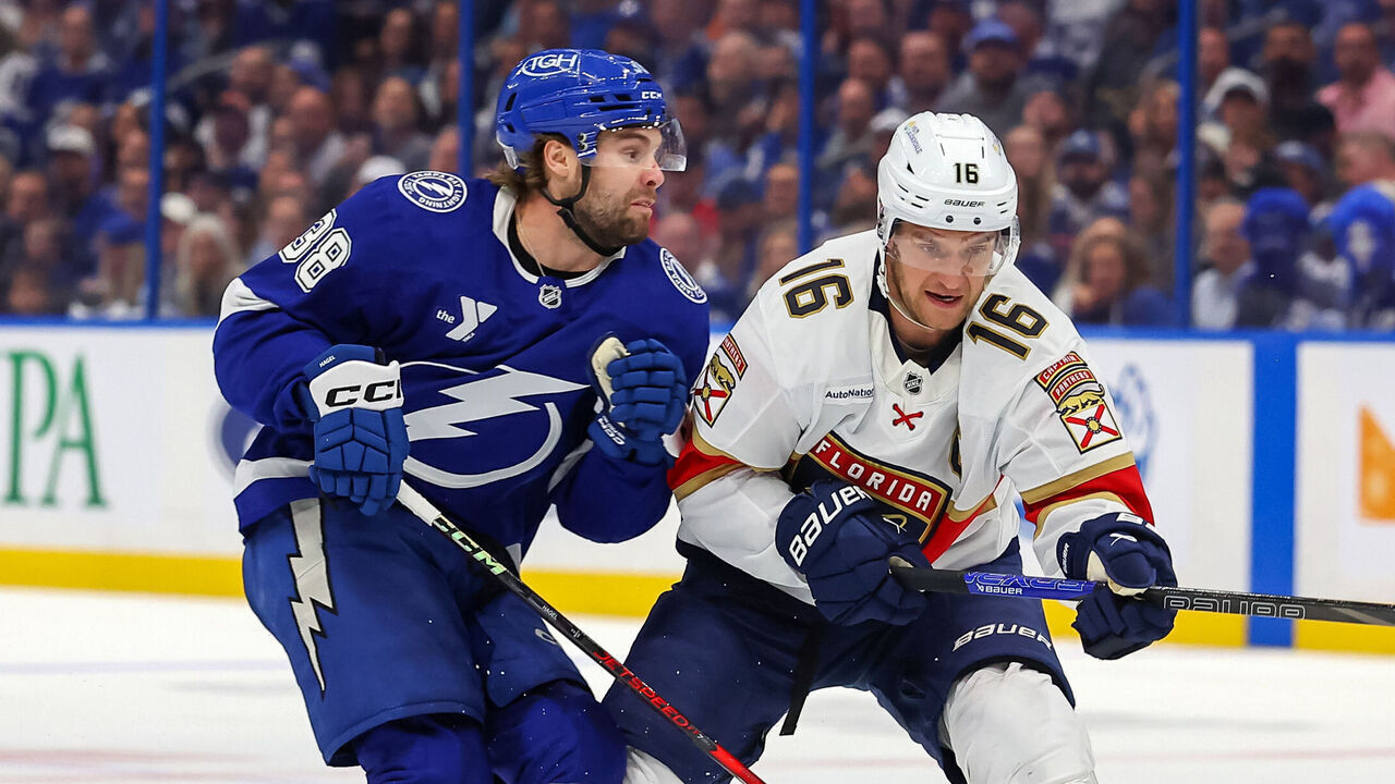 TAMPA, FL - APRIL 22: Brandon Hagel #38 of the Tampa Bay Lightning looks to hit Aleksander Barkov #16 of the Florida Panthers in the first period of Game One of the First Round of the 2025 Stanley Cup Playoffs at the Amalie Arena on April 22, 2025 in Tampa, Florida.