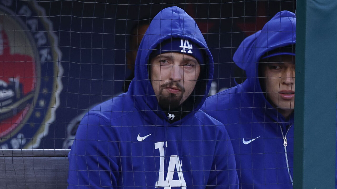 WASHINGTON, DC - APRIL 8: Blake Snell (L) #7 of the Los Angeles Dodgers and Roki Sasaki #11 sit in the dugout in the second inning during a game against the Washington Nationals at Nationals Park on April 8, 2025 in Washington, DC.