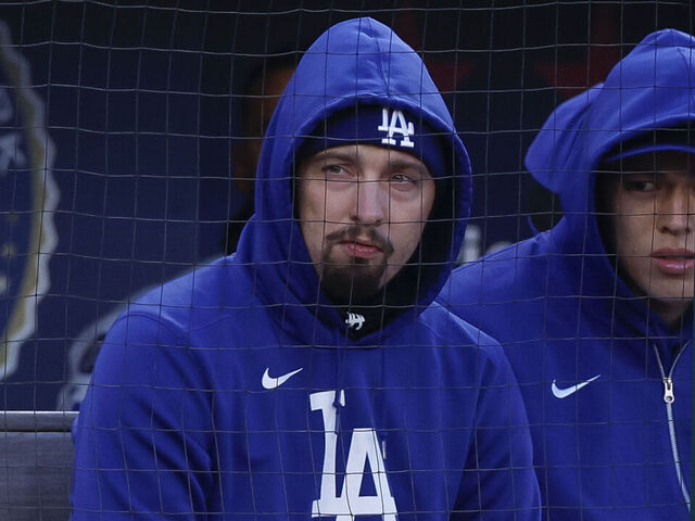 WASHINGTON, DC - APRIL 8: Blake Snell (L) #7 of the Los Angeles Dodgers and Roki Sasaki #11 sit in the dugout in the second inning during a game against the Washington Nationals at Nationals Park on April 8, 2025 in Washington, DC.
