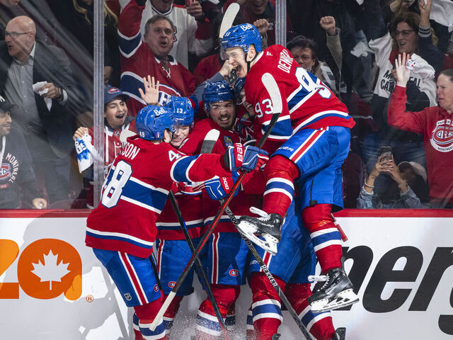 MONTREAL, CANADA- APRIL 25: Nick Suzuki #14 of the Montreal Canadiens celebrates after scoring a goal during the second period of the Game Three of the First Round of the 2025 NHL Stanley Cup Playoffs between the Montreal Canadiens and the Washington Capitals at the Bell Centre on April 25, 2025 in Montreal, Quebec, Canada.