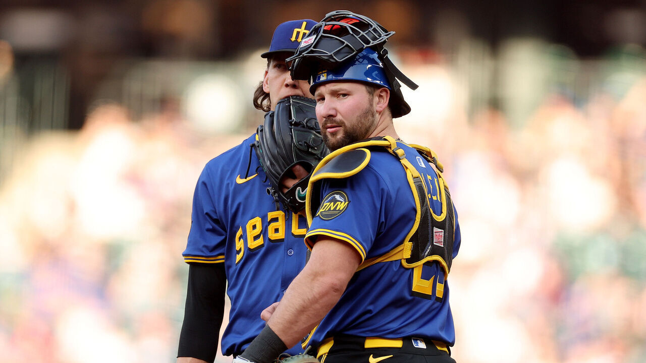 SEATTLE, WASHINGTON - APRIL 25: Logan Gilbert #36 and Cal Raleigh #29 of the Seattle Mariners look on during the first inning against the Miami Marlins at T-Mobile Park on April 25, 2025 in Seattle, Washington.