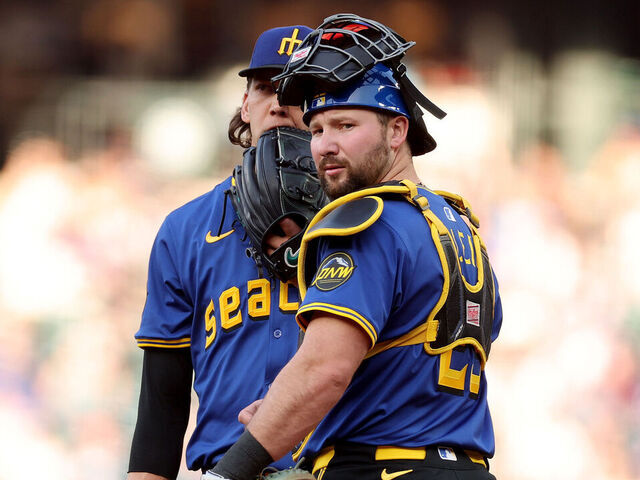 SEATTLE, WASHINGTON - APRIL 25: Logan Gilbert #36 and Cal Raleigh #29 of the Seattle Mariners look on during the first inning against the Miami Marlins at T-Mobile Park on April 25, 2025 in Seattle, Washington.