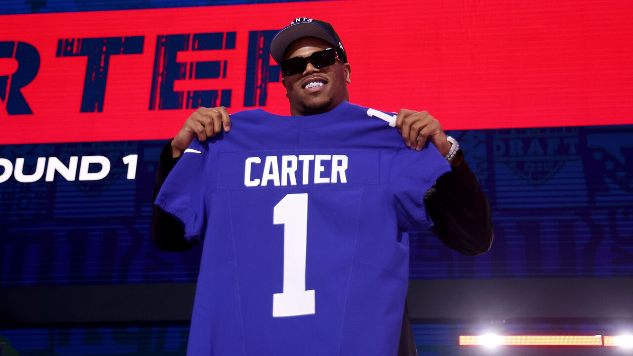 GREEN BAY, WISCONSIN - APRIL 24: Edge Rusher Abdul Carter of Penn State poses after being selected third overall pick by the New York Giants during the first round of the 2025 NFL Draft at Lambeau Field on April 24, 2025 in Green Bay, Wisconsin.