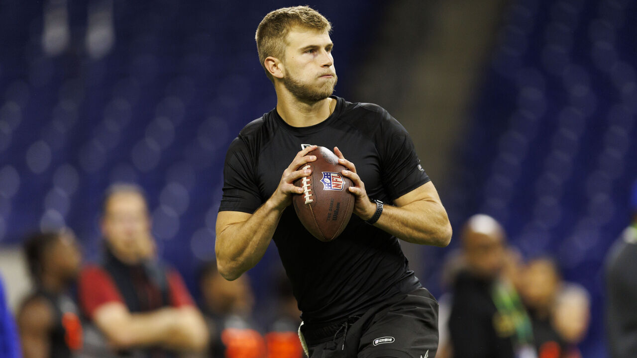 INDIANAPOLIS, INDIANA - MARCH 1: Tyler Shough #QB14 of Louisville participates in a drill during the NFL Scouting Combine at Lucas Oil Stadium on March 1, 2025 in Indianapolis, Indiana.