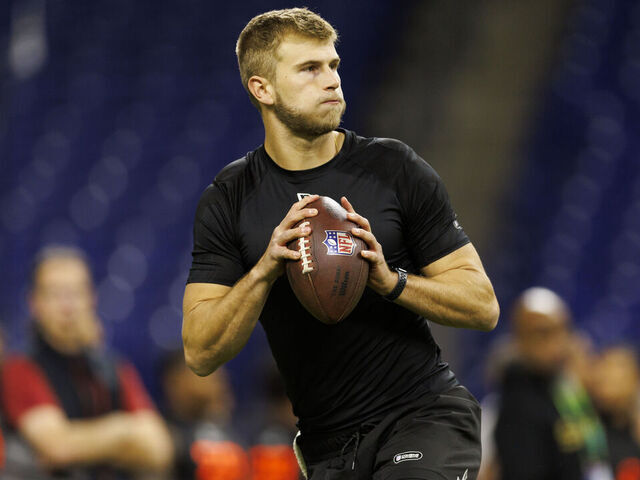 INDIANAPOLIS, INDIANA - MARCH 1: Tyler Shough #QB14 of Louisville participates in a drill during the NFL Scouting Combine at Lucas Oil Stadium on March 1, 2025 in Indianapolis, Indiana.