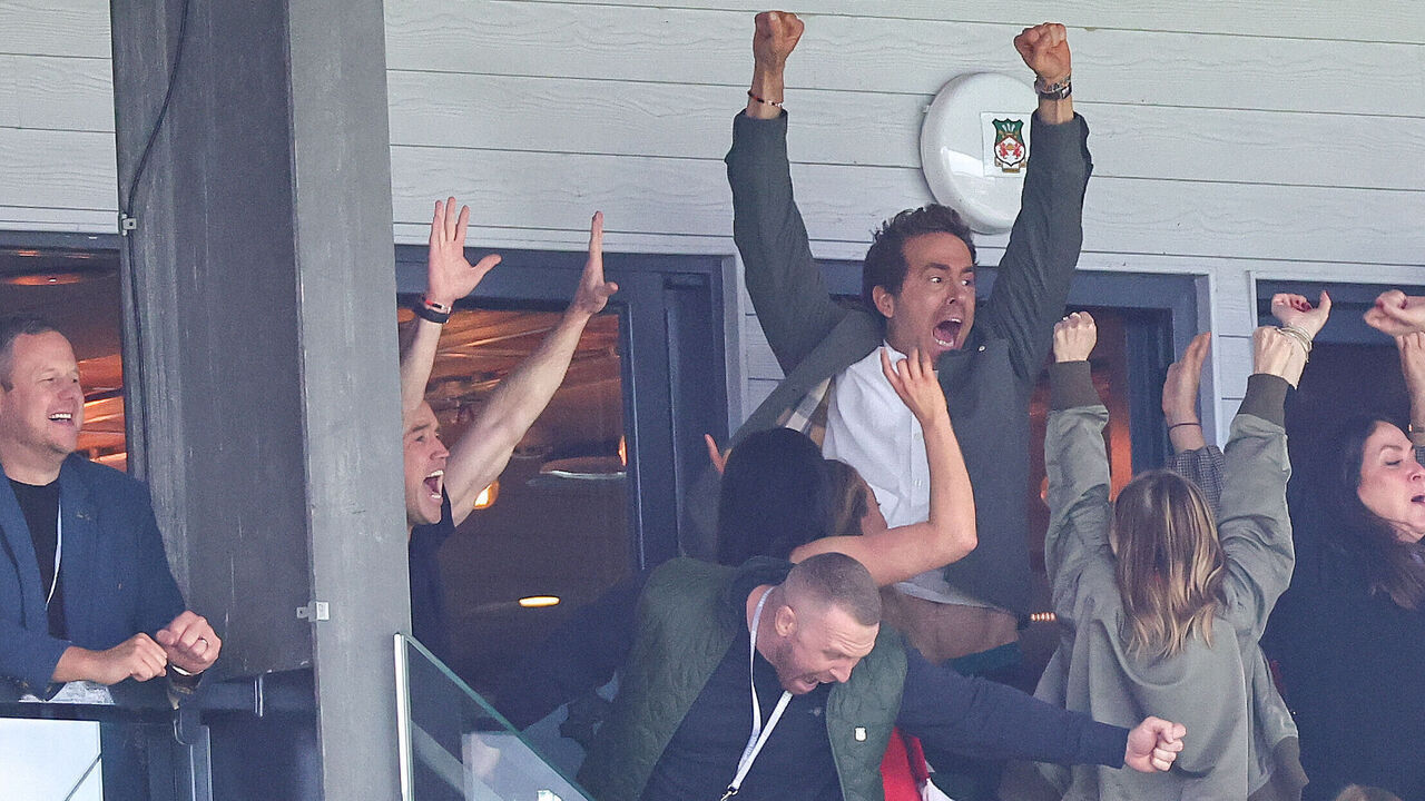 WREXHAM, WALES - APRIL 26: Ryan Reynolds co-owner of Wrexham celebrates the opening goal ahead of the Sky Bet League One match between Wrexham AFC and Charlton Athletic FC at Racecourse Ground on April 26, 2025 in Wrexham, Wales.