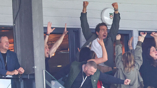 WREXHAM, WALES - APRIL 26: Ryan Reynolds co-owner of Wrexham celebrates the opening goal ahead of the Sky Bet League One match between Wrexham AFC and Charlton Athletic FC at Racecourse Ground on April 26, 2025 in Wrexham, Wales.