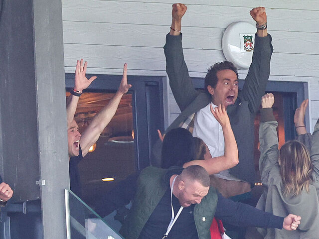 WREXHAM, WALES - APRIL 26: Ryan Reynolds co-owner of Wrexham celebrates the opening goal ahead of the Sky Bet League One match between Wrexham AFC and Charlton Athletic FC at Racecourse Ground on April 26, 2025 in Wrexham, Wales.