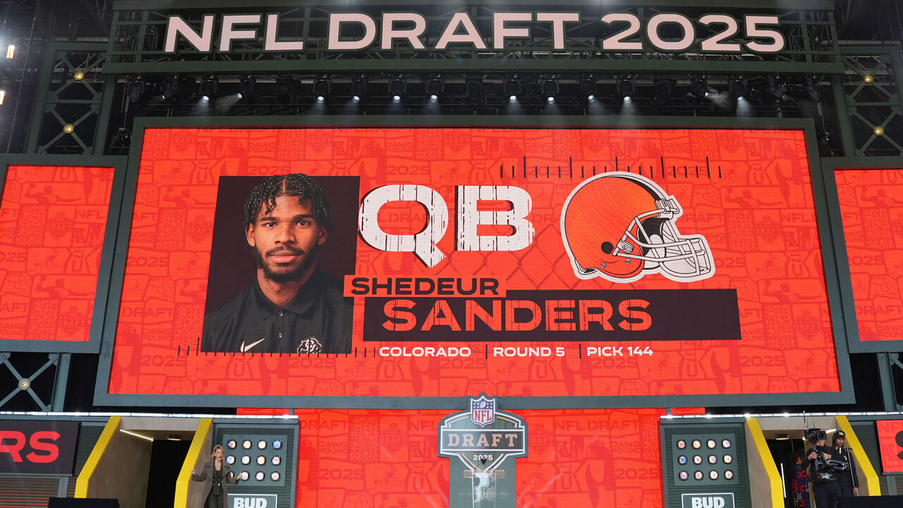GREEN BAY, WISCONSIN - APRIL 26: A screen shows Colorado quarterback Shedeur Sanders' name after being selected by the Cleveland Browns with the 144th overall pick during the fifth round of the 2025 NFL Draft on April 26, 2025 in Green Bay, Wisconsin.