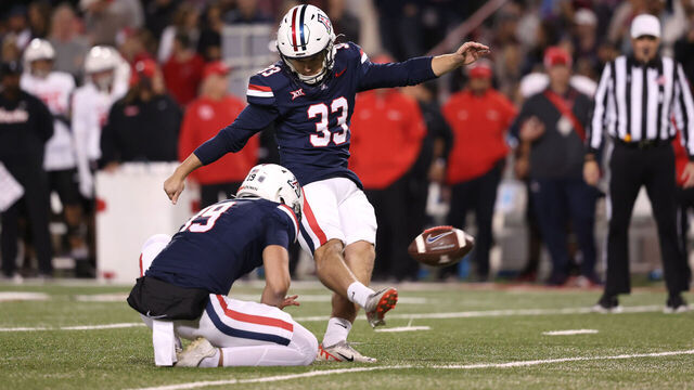 TUCSON, ARIZONA - NOVEMBER 15: Place kicker Tyler Loop #33 of the Arizona Wildcats kicks a field goal during the game against the Houston Cougars at Arizona Stadium on November 15, 2024 in Tucson, Arizona. The Wildcats defeated the Cougars 27-3.