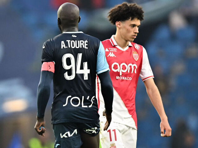 Le Havre's Guinean midfielder #94 Abdoulaye Toure (L) shakes hands with Monaco's French midfielder #11 Maghnes Akliouche at the end of the French L1 football match between Le Havre AC and AS Monaco at the Stade Oceane in Le Havre, north-western France, on April 26, 2025.