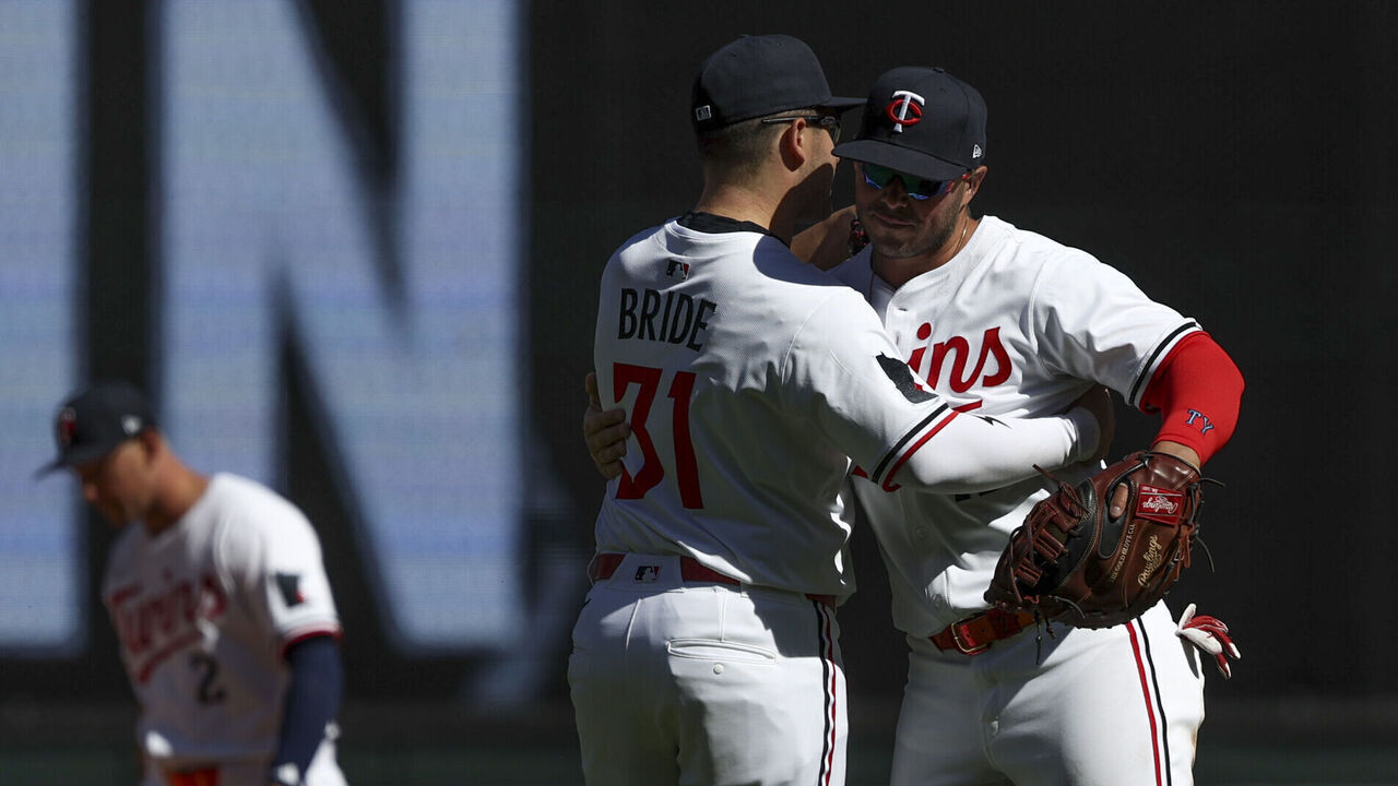MINNEAPOLIS, MINNESOTA - APRIL 26: Jonah Bride #31 of the Minnesota Twins and Ty France #13 of the Minnesota Twins celebrate afer winning a game against the Los Angeles Angels at Target Field on April 26, 2025 in Minneapolis, Minnesota.